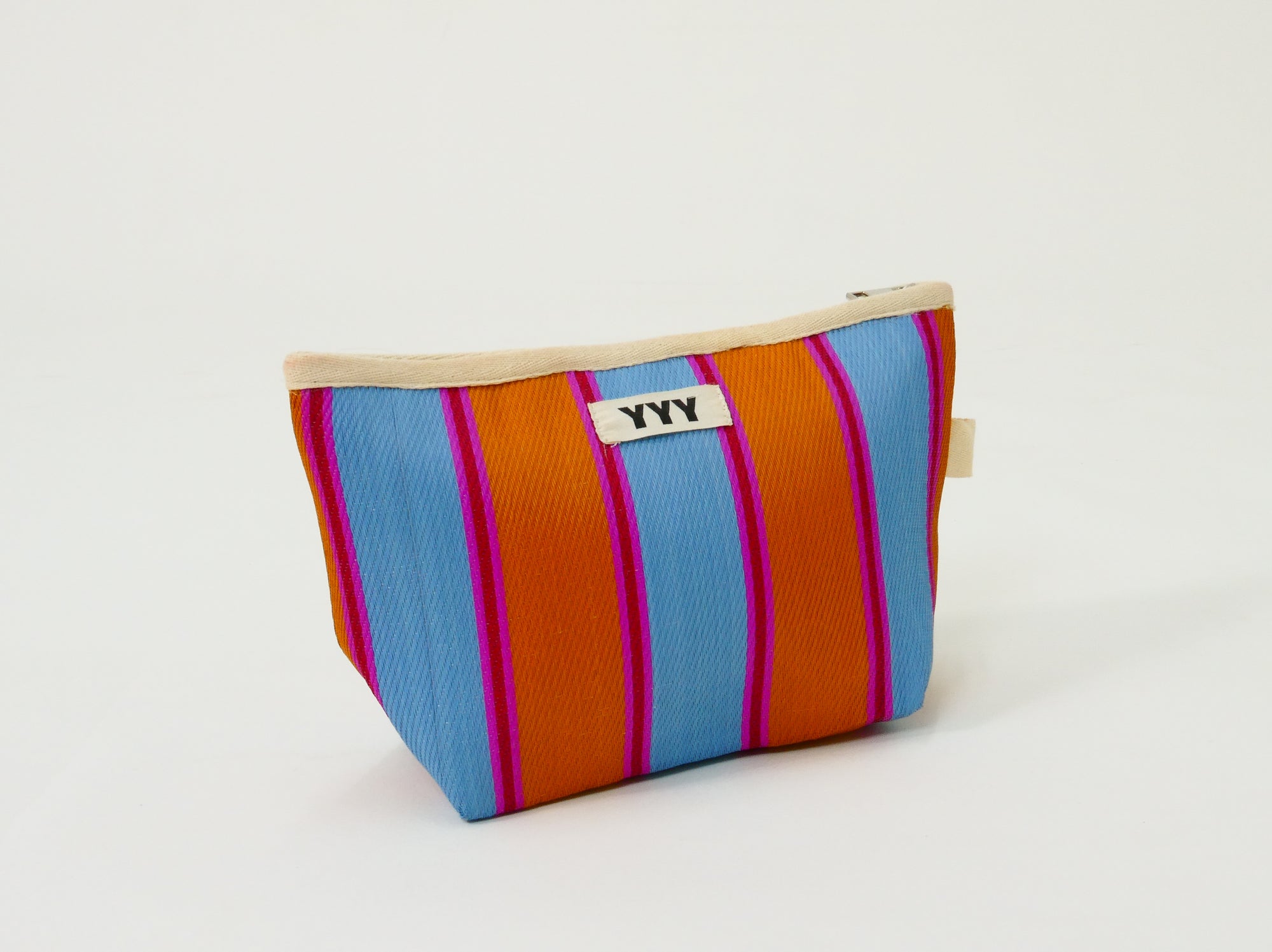 Handmade clutch bag with orange and blue striped design