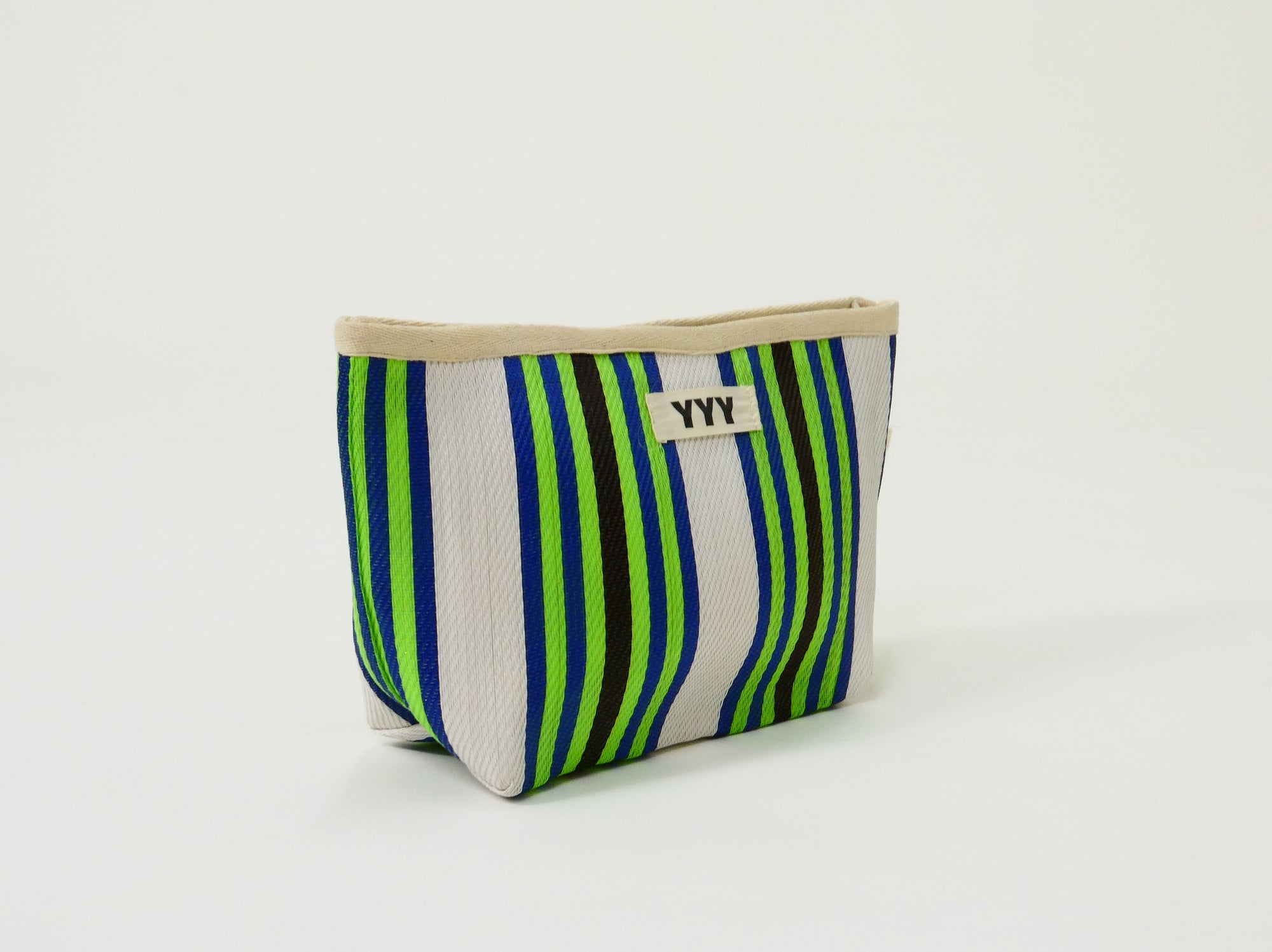 The Clutch Bag in green, black, and white stripes