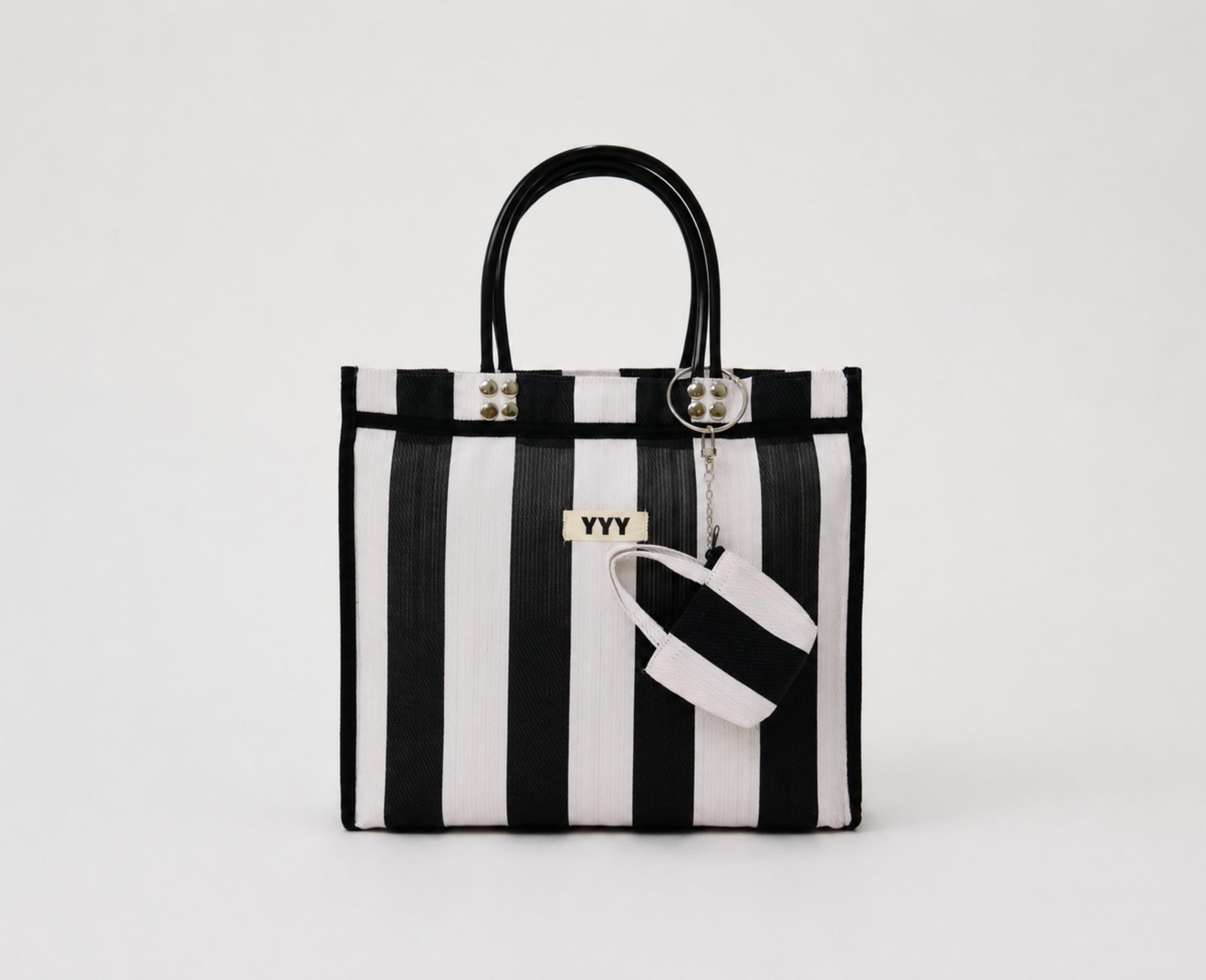 The Tote handmade bag in black and white stripes made from 100% recycled plastic