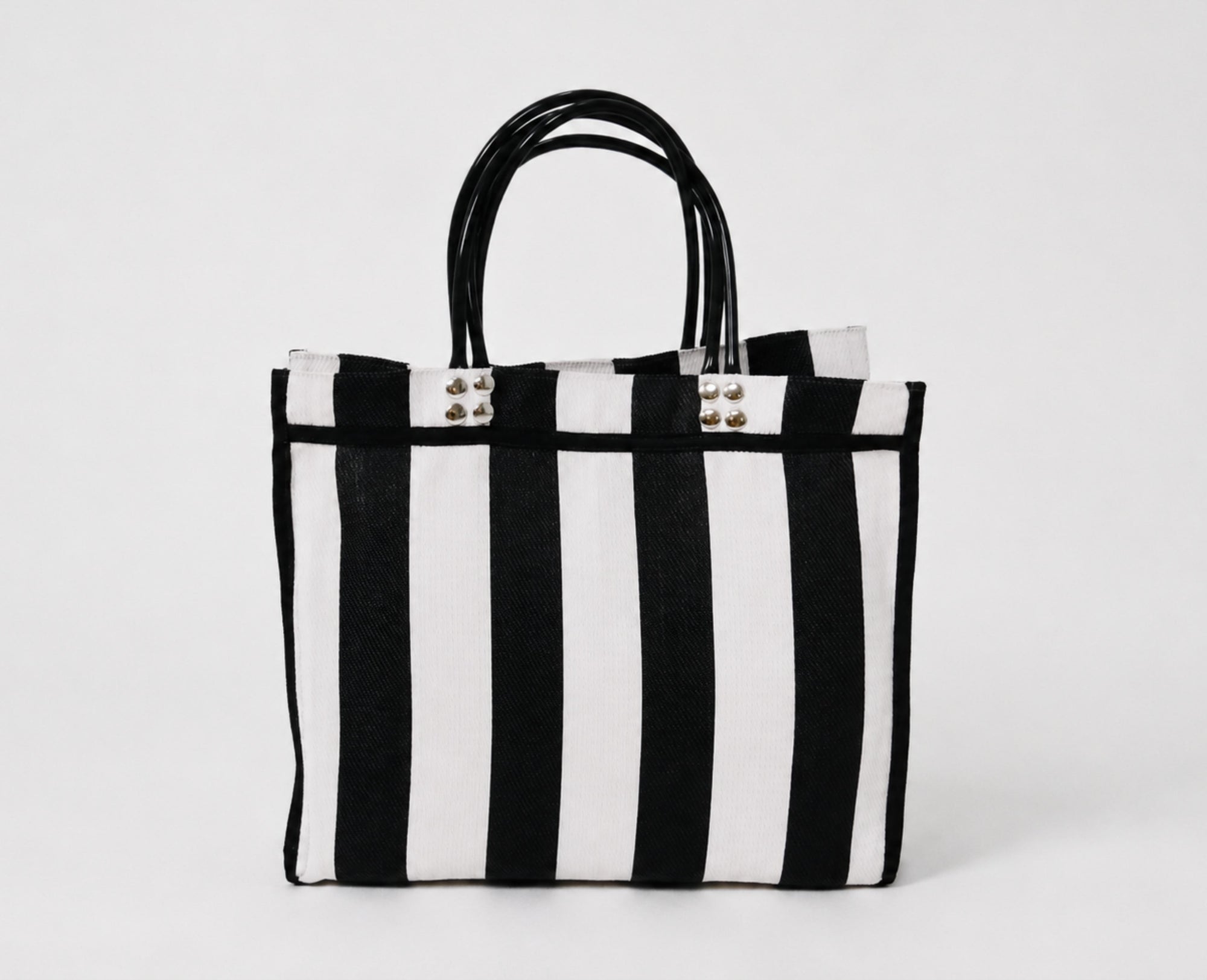 Back view of The Tote handmade recycled plastic bag with striped design