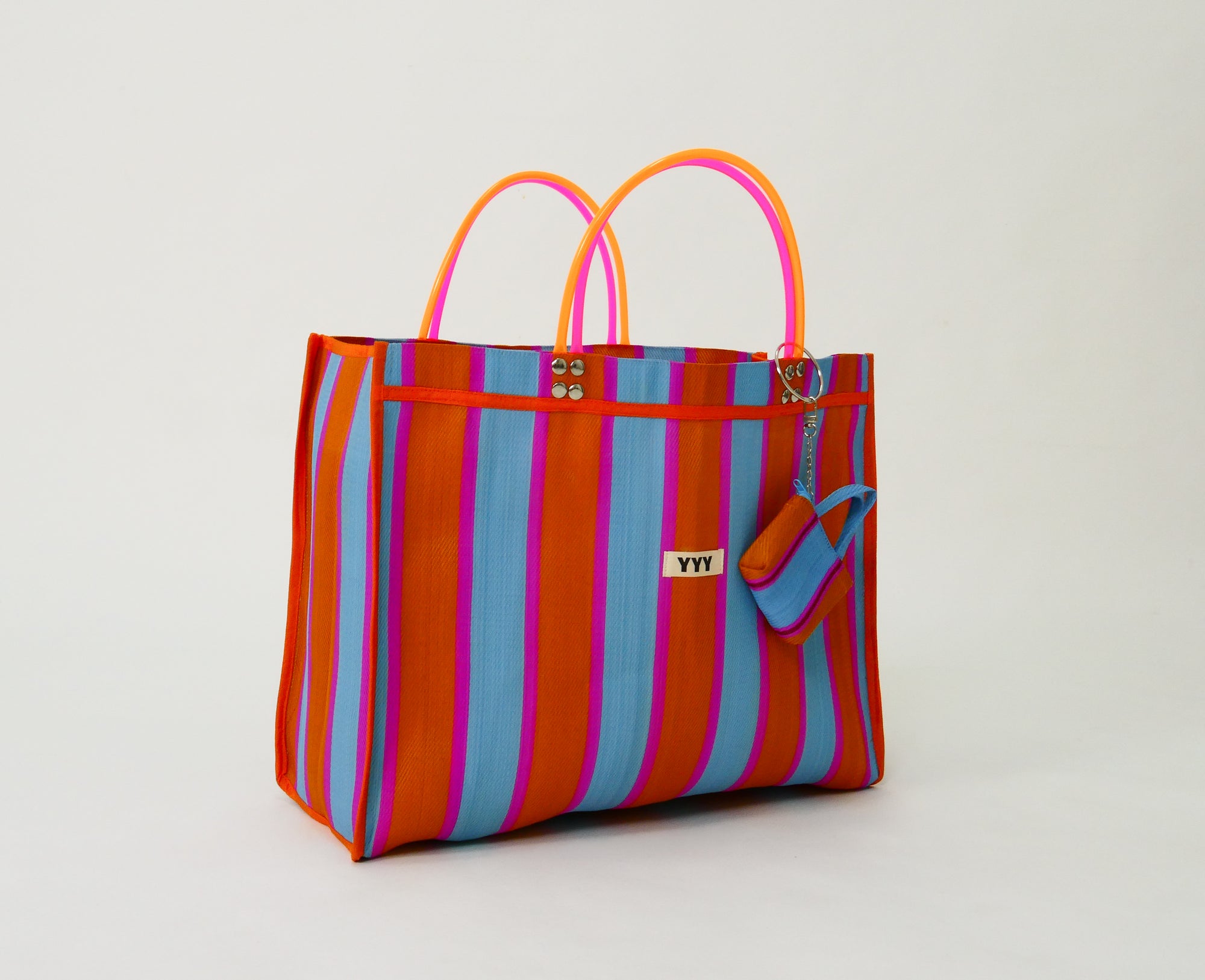 Colorful striped tote bag with a matching mini pouch included with The Huge tote bag