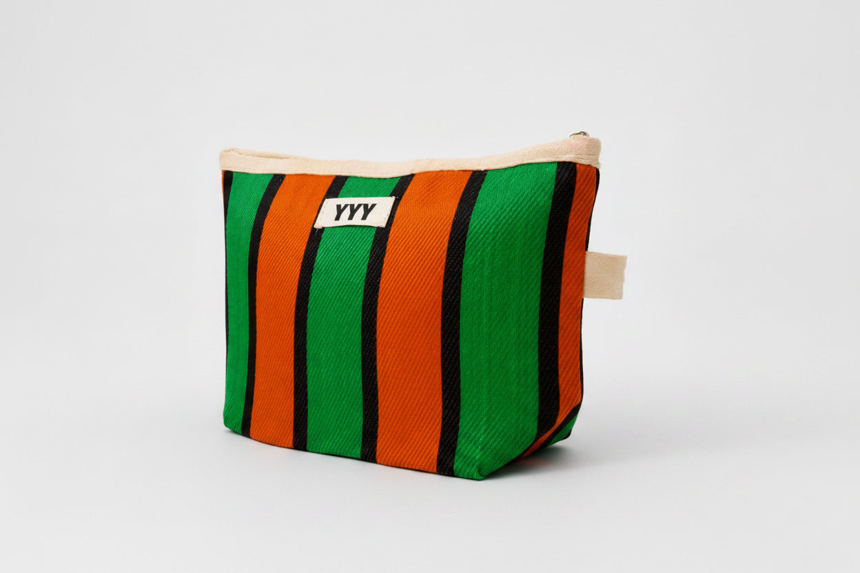 Striped pouch with green, orange, and black stripes on a white background