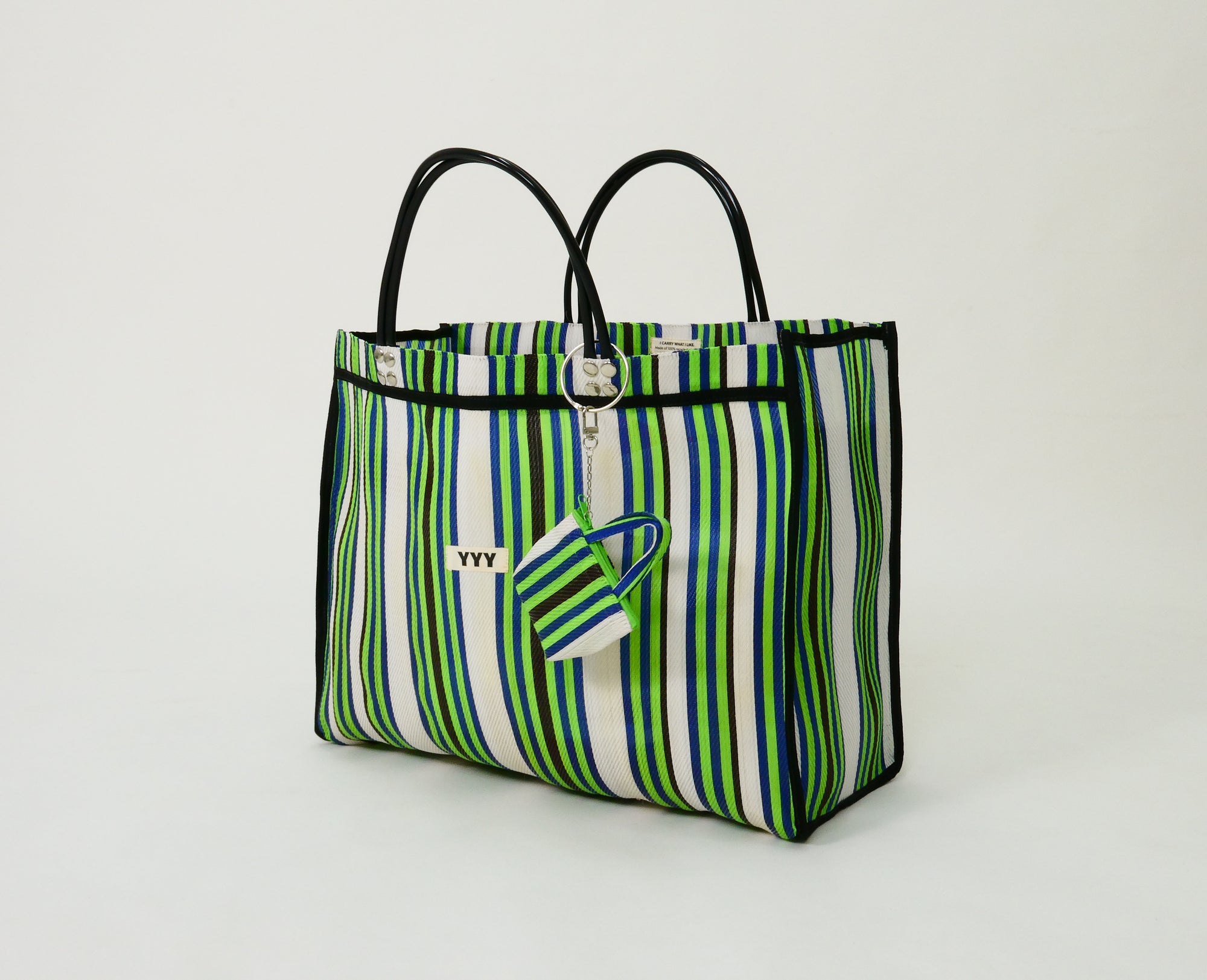 Side view of The Huge recycled plastic tote bag with striped pattern