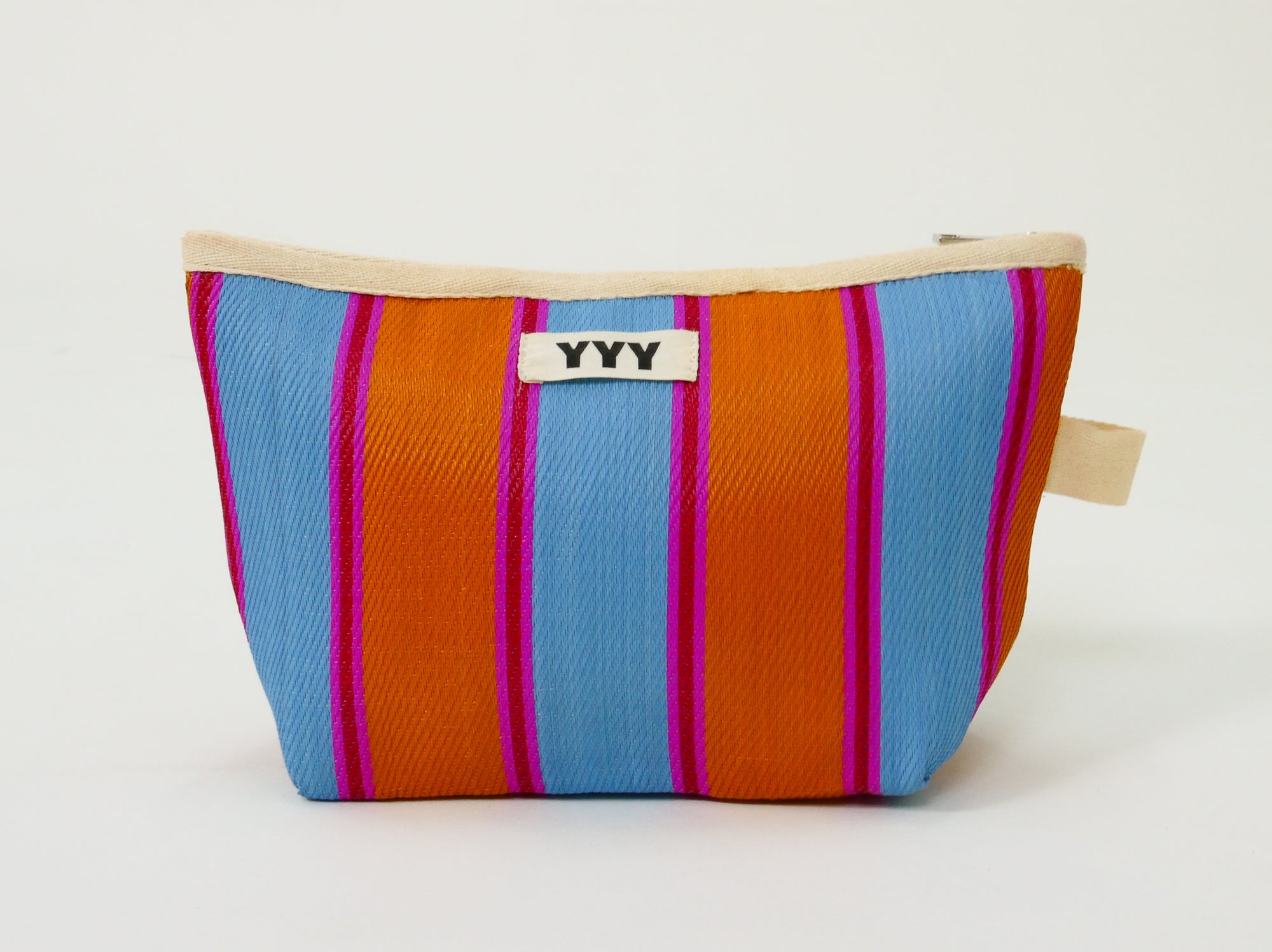 Compact recycled plastic clutch designed for everyday essentials