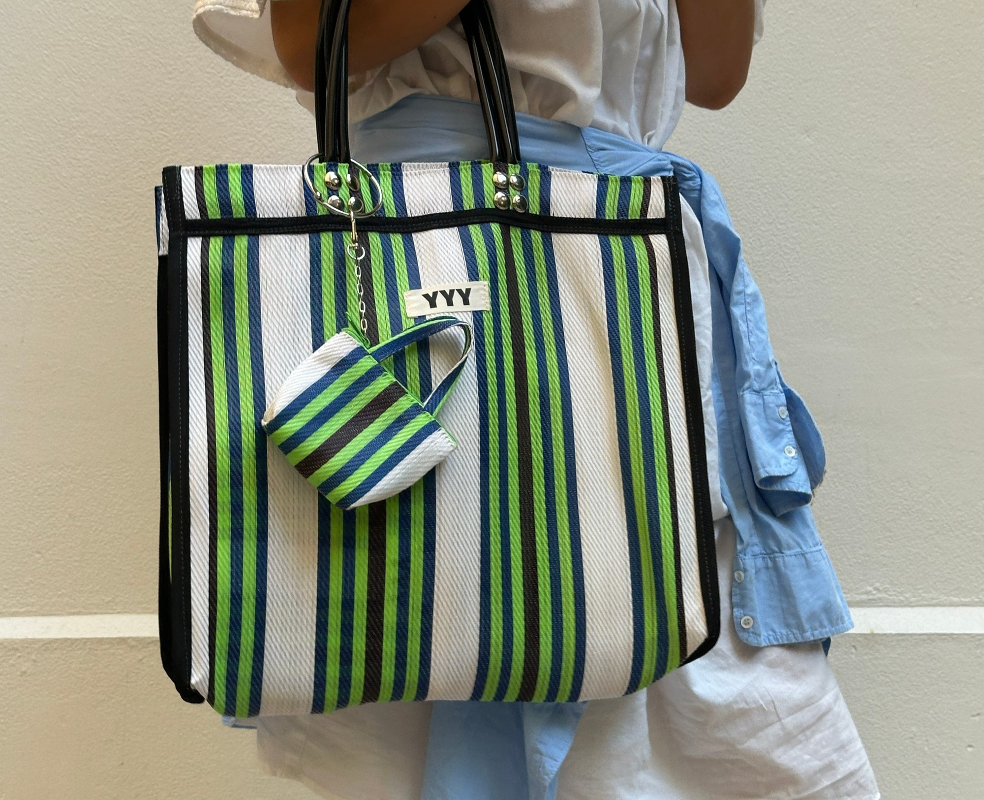 Colorful recycled plastic tote bag in green and white stripes