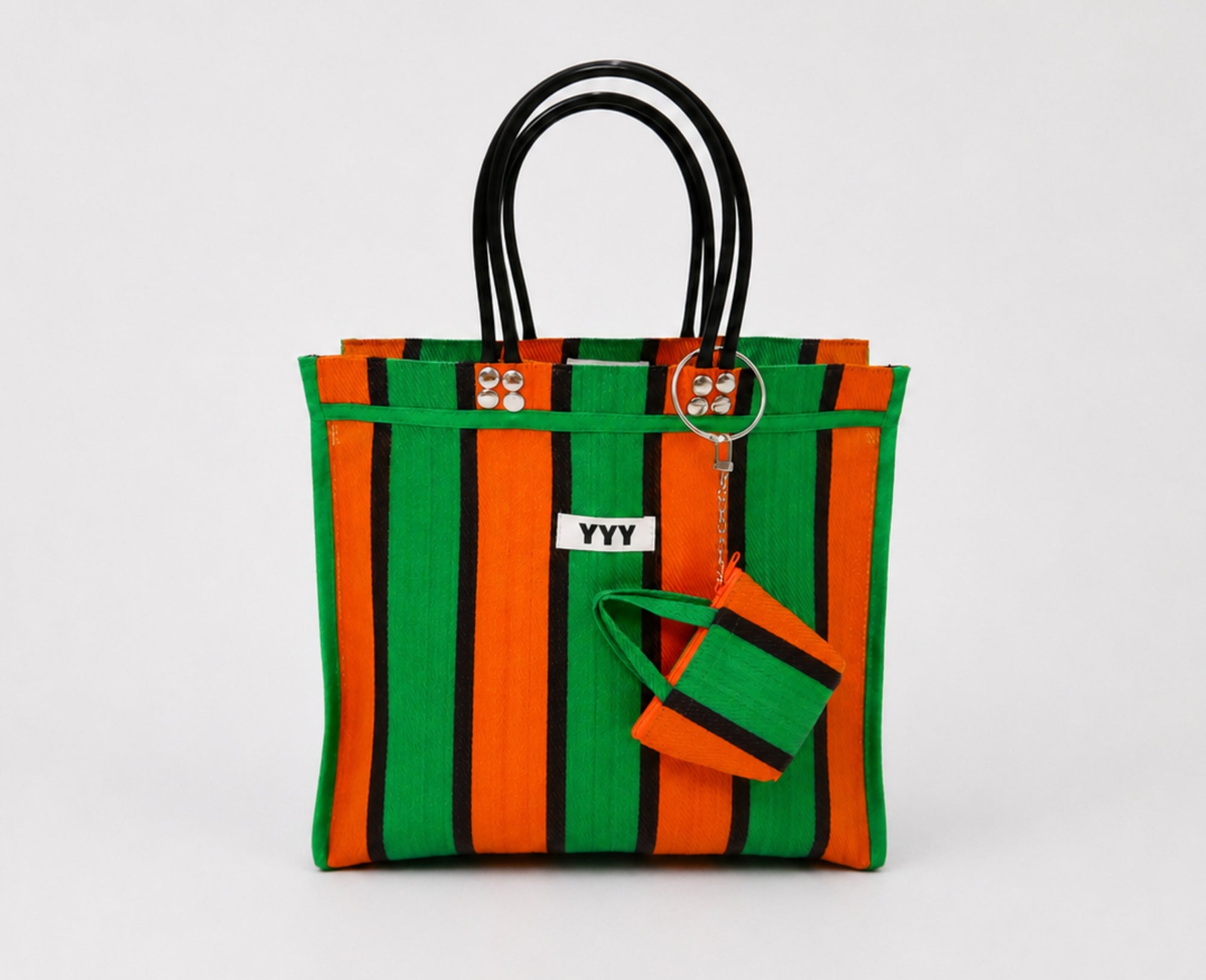 The Tote handmade bag in orange, green, and black stripes made from recycled plastic
