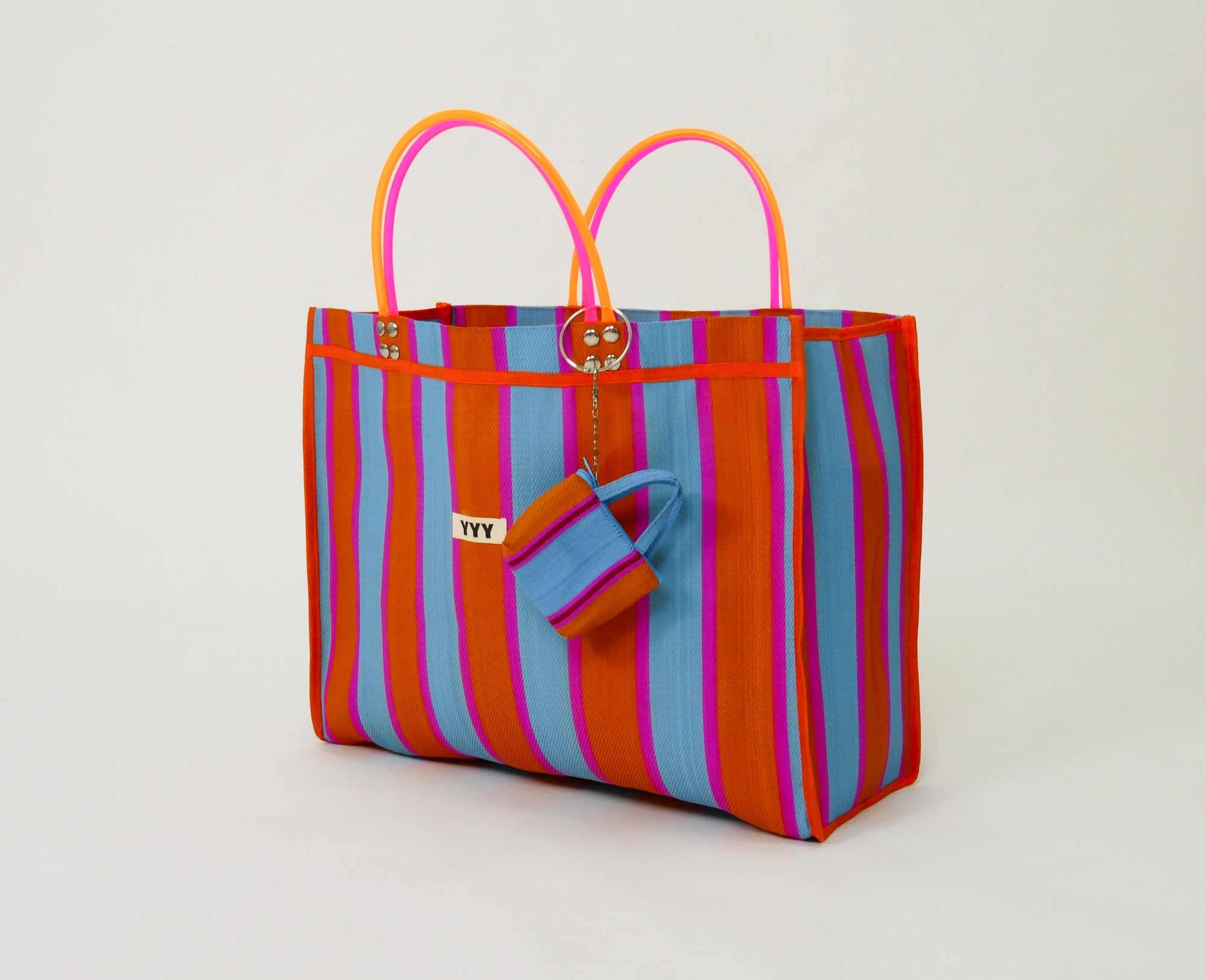 Side view of The Huge recycled plastic tote bag with striped pattern