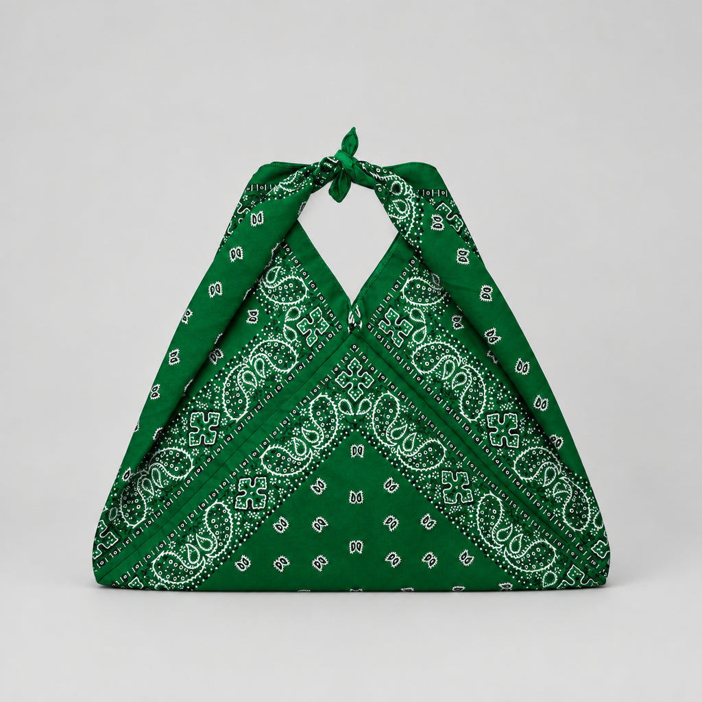 A green bandana-style halter bag with a white paisley and small floral print